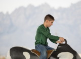 Riding a mechanical bull at Farm and Ranch Museum