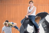Riding a mechanical bull at Farm and Ranch Museum