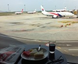 Loungelunch at KLIA. Next stop Kuching. Note the headline in the newspaper...