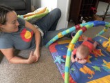 Tia teaches Jack how to master tummy time