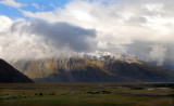 Snow clouds and rainbow