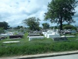 Main Road cuts through a Cemetery in Belize