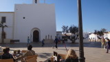 Football game in Sant Francesc with the doors of the church being used as the goal