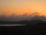 Cloud  sitting  on Sewingshield  Crags