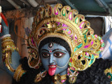 Goddess Kali is depicted with her tongue hanging out.