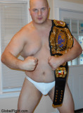 holding his pro wrestling belt champion.jpg