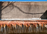 Stucco and tin. Cuero, TX