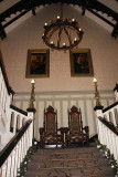 Stairs going to the second floor from the lobby.