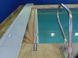 Lap pool with retractable cover