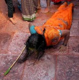 Devotees that have made vows circle round the temple and prostrate every few metres,Yellamma temple,Saundatti,Karnataka, India.