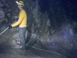 Lower Caverns Tour - Ranger Ben demonstrating repelling down the rope