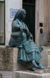Statue of a Seated Barefoot Peasant Girl Carrying a Jar