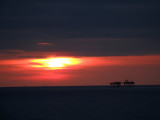 Passing oil rigs at sunset 21 Mar, 15