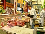 The butcher has just started preparing his Fiorentina steaks
