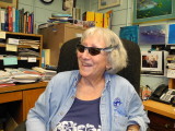 Genie in her office with her Shark sun glasses 