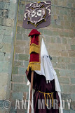 Penitente carrying banner