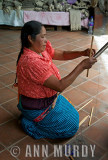 Lady setting up her loom