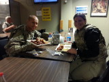 Tim and Daphne having chicken wings and fries on Monday night in Bagram, Afghanistan