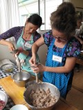 Rose and Tracey stuffing sausage