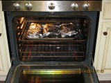 In the oven at 250 Degrees  for two hours.