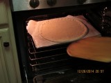 Preheat oven to 500 degrees F for at least one hour before forming the pizza. Drop the temperature to 450 degrees and transfer t