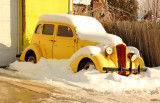 old car in the snow  the day after