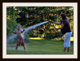 Mom Hoses Away The Mud