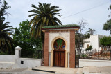 Modern gate to a Moorish-style villa near the turn off leading to Sidi Boumediene