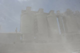 The train passes through a horrible area of dust as it passes the cement factory