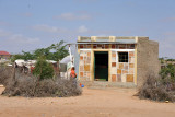 Sturdy little house with a decorated faade