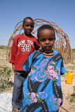 Somali girl and her brother sporting a red New York shirt