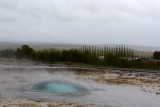 At the start of the eruption, first a smooth bulge forms in the water