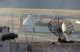 Satellite dishes with the mosque standing off in the distance, Murghab