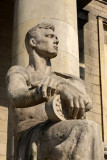 Socialist Realism sculpture - seated worker holding a bearing, PKiN