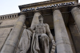 Socialist-Realist sculpture of a seated worker holding a gear, Teatr Dramatyczny 