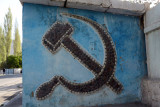 Hammer and Sickle of the USSR in stone mosaic on a Khorog bus st