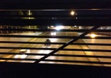 View through the railing of the Interurban Trail bridge over South 180th Street