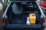 BED SYSTEM 1: Seat backs folded down for diagonal sleeping in Subaru GL wagon (004)