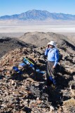 Phoning home from Tetzlaff Peaks summit ridge