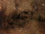 Les nébuleuses sombres Barnard 65, 66, 67