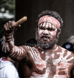 Aboriginal busker with clapsticks