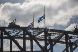 Sydney Harbour Bridge with half mast flags 