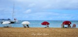 Red and White Beach Umbrellas, Waikiki, Oahu, Hawaii