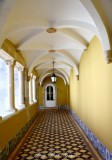 white door, yellow hallway