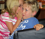 Charli whispering to cousin Toby