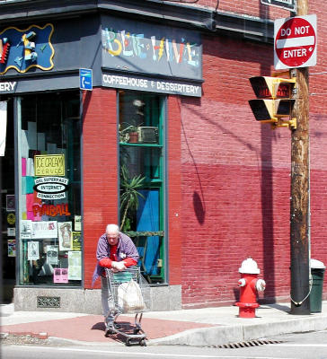 Shopping cart helps man across street