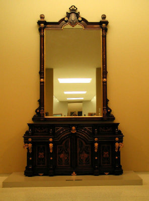 Gorgeous antique furniture is displayed with fine art...guess it IS fine art!