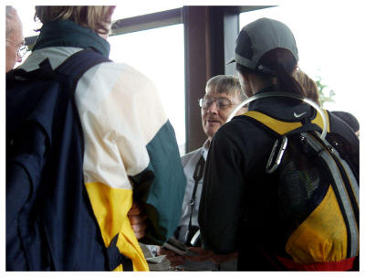 Talking with other retiree at visitor's center.