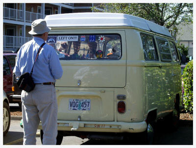 Admiring a vw bus and bumperstickers
