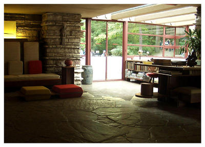 Fallingwater: View of living area w/ exit to cantilevered patio. Stone for the house was quarried from the area.